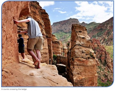 Abune-Yemata-Church-a-Tourist-crossing-ledge.jpg